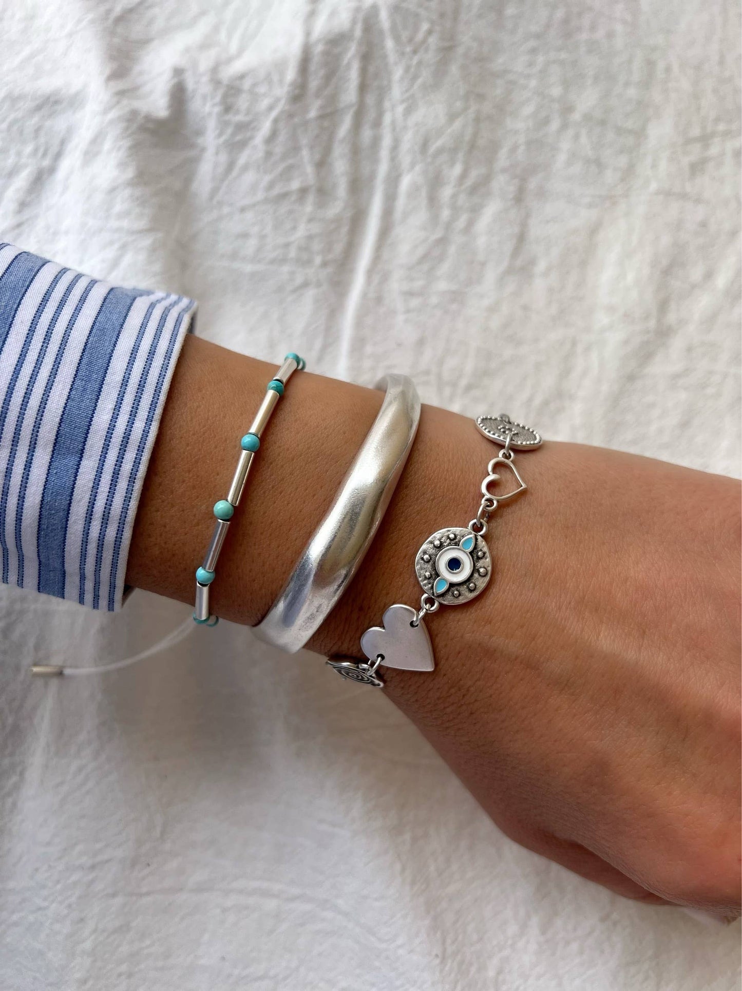 Pulsera triple de acero y plata