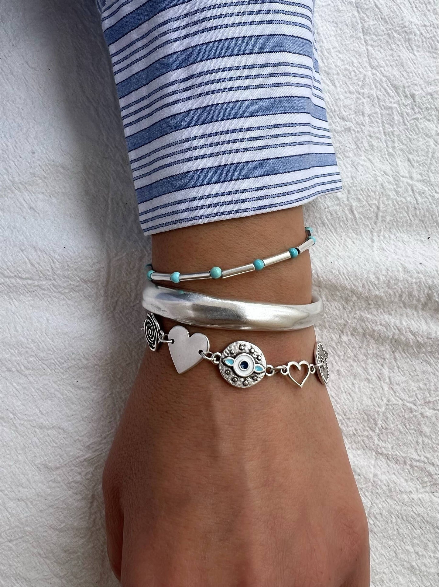 Pulsera triple de acero y plata