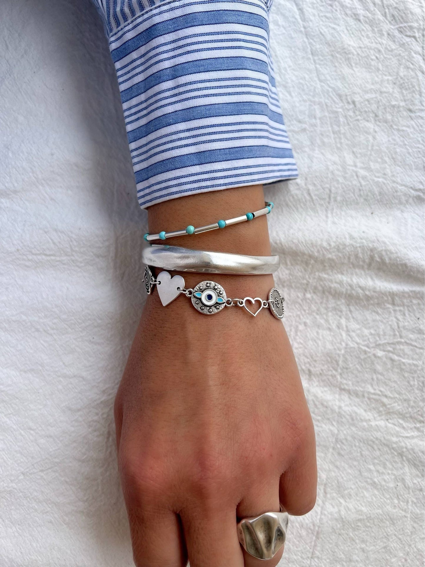 Pulsera triple de acero y plata